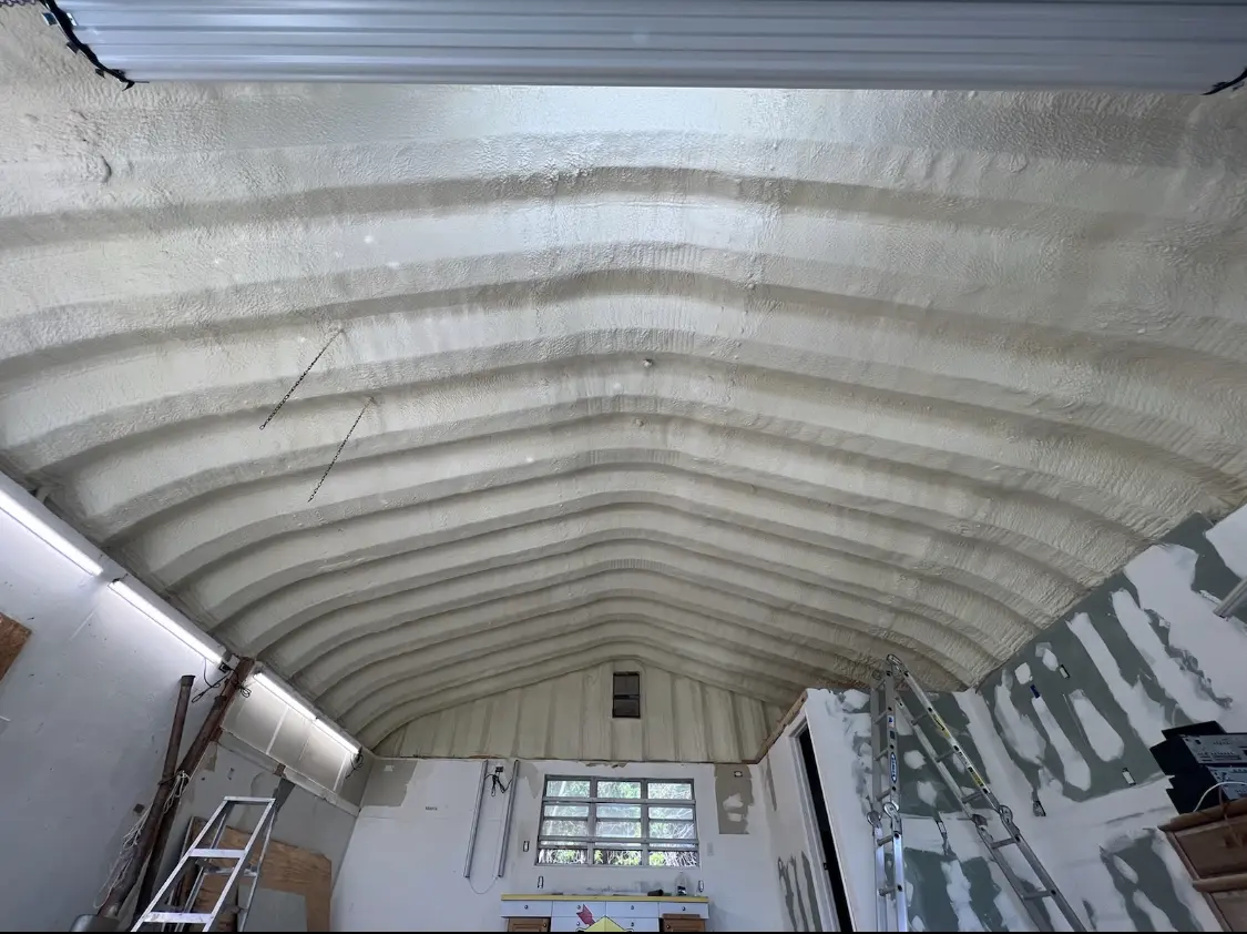 Spray polyurethane foam applied to the underside of a metal roof deck in Gibsonton